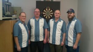 JB Darts team board smiling